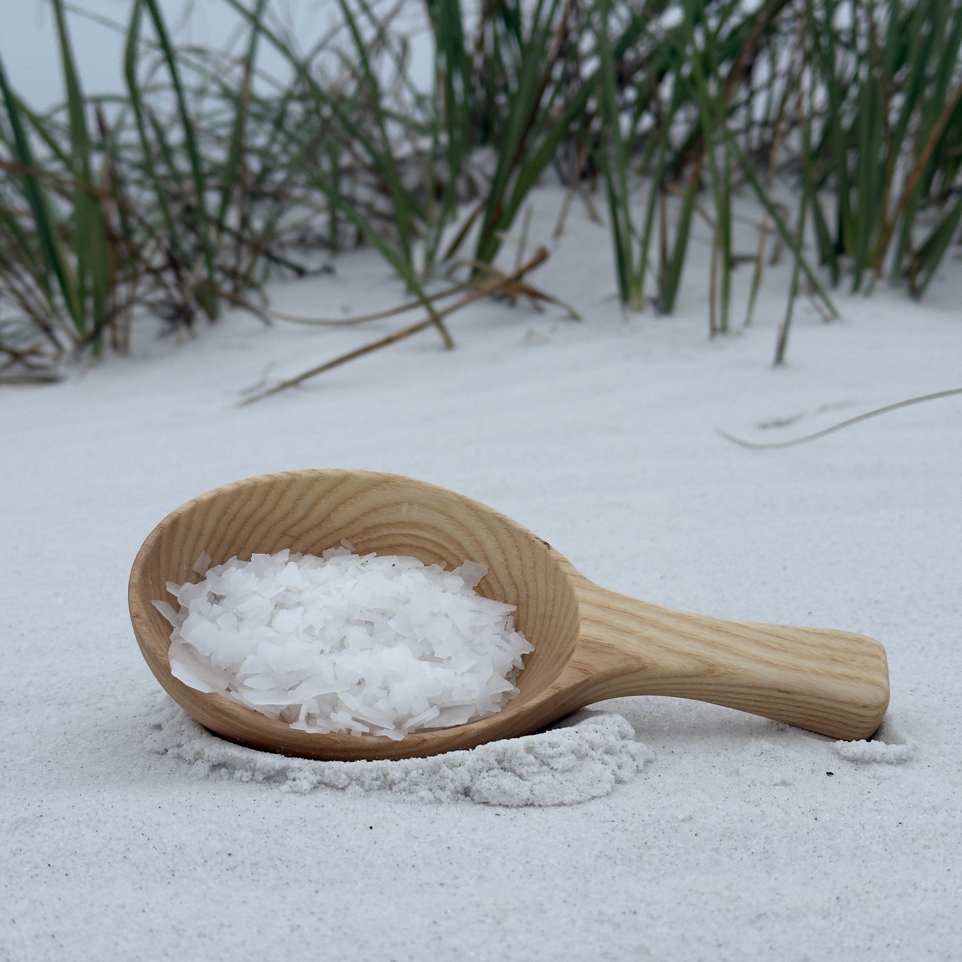 magnesium flakes on a wood spoon